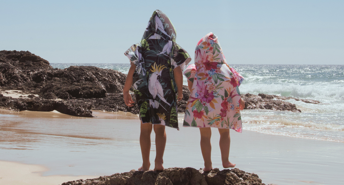 Bird of Paradise and Island Princess a boy and girl look out from Elephant Rock at Currumbin Beach