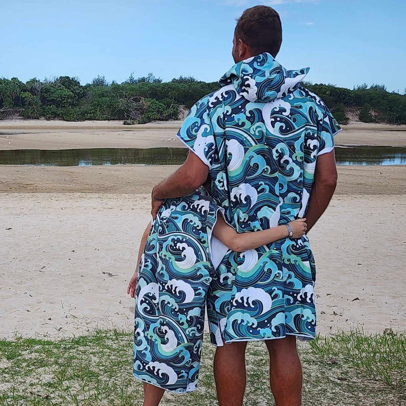 Wipeout Sand-Free Hoodies (One Size Fits All): Dad & Son Sharing a Moment at Hastings Point Lagoon. [Father and son embrace, enjoying the view of the calm tidal lagoon at Hastings Point, NSW.]