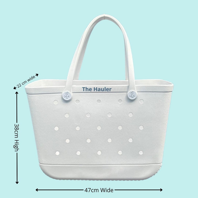 The Hauler White Haven Silicone Bag: Spacious & Functional. [Detailed size chart: Height 38cm, Width 47cm, Top Depth 22cm. Perfect for carrying all your beach essentials in style.]